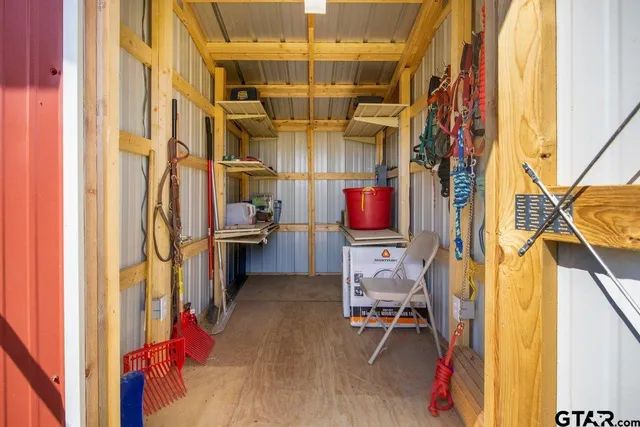 a view of a room with chairs and furniture