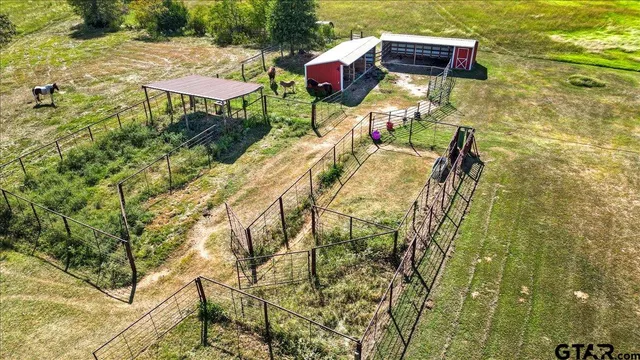 a view of an chairs and table in the patio
