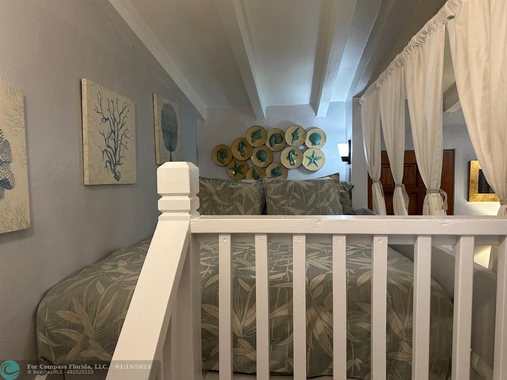 1605 Southwest 25th Street, Unit 4 Fort Lauderdale, FL 33315 - Photo 7 of 14 a view of a room with wooden floor and windows