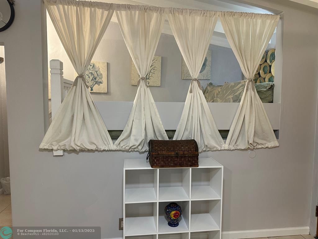 1605 Southwest 25th Street, Unit 4 Fort Lauderdale, FL 33315 - Photo 10 of 14 a view of walk in closet with clothes and shoes