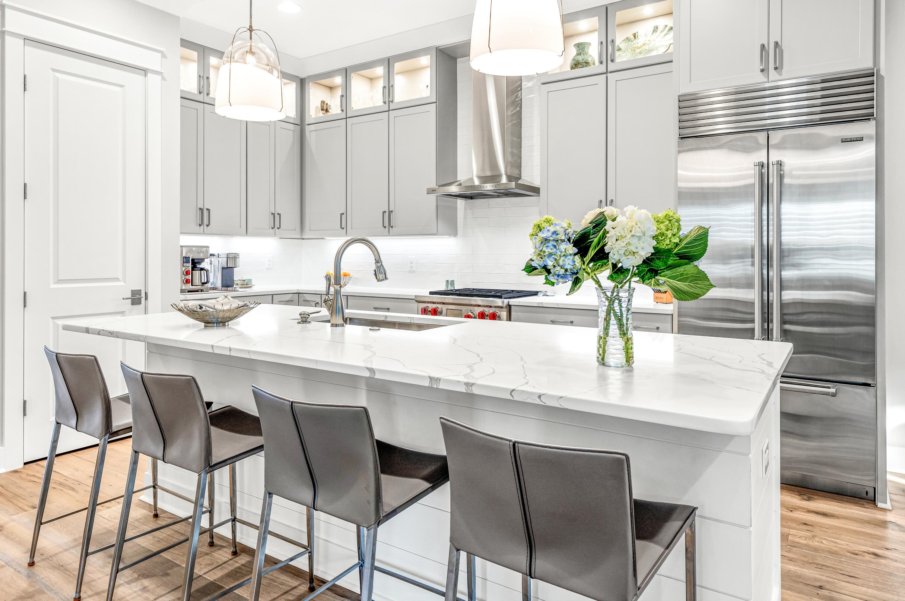 a kitchen with a table and chairs in it