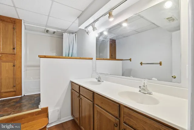 a bathroom with a sink and a mirror