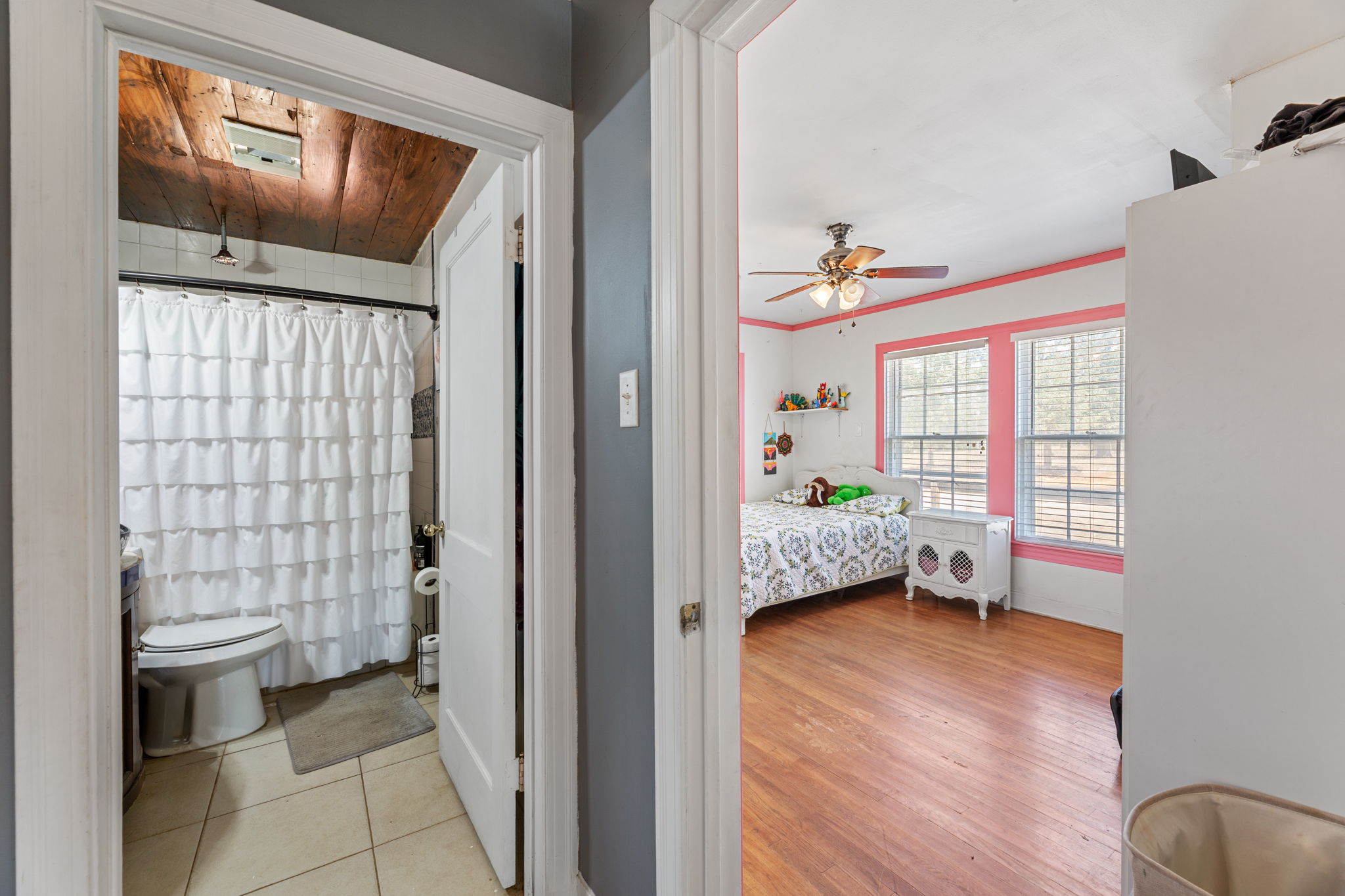 274 Old Potato Road Paige, TX 78659 - Photo 14 of 39 Bedroom with connected bathroom, ceiling fan, light wood finished floors, wood ceiling, and ornamental molding