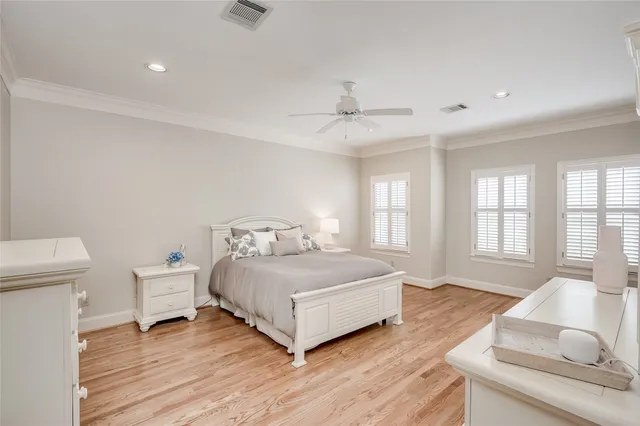 a large kitchen with granite countertop a sink a counter top space stainless steel appliances and cabinets