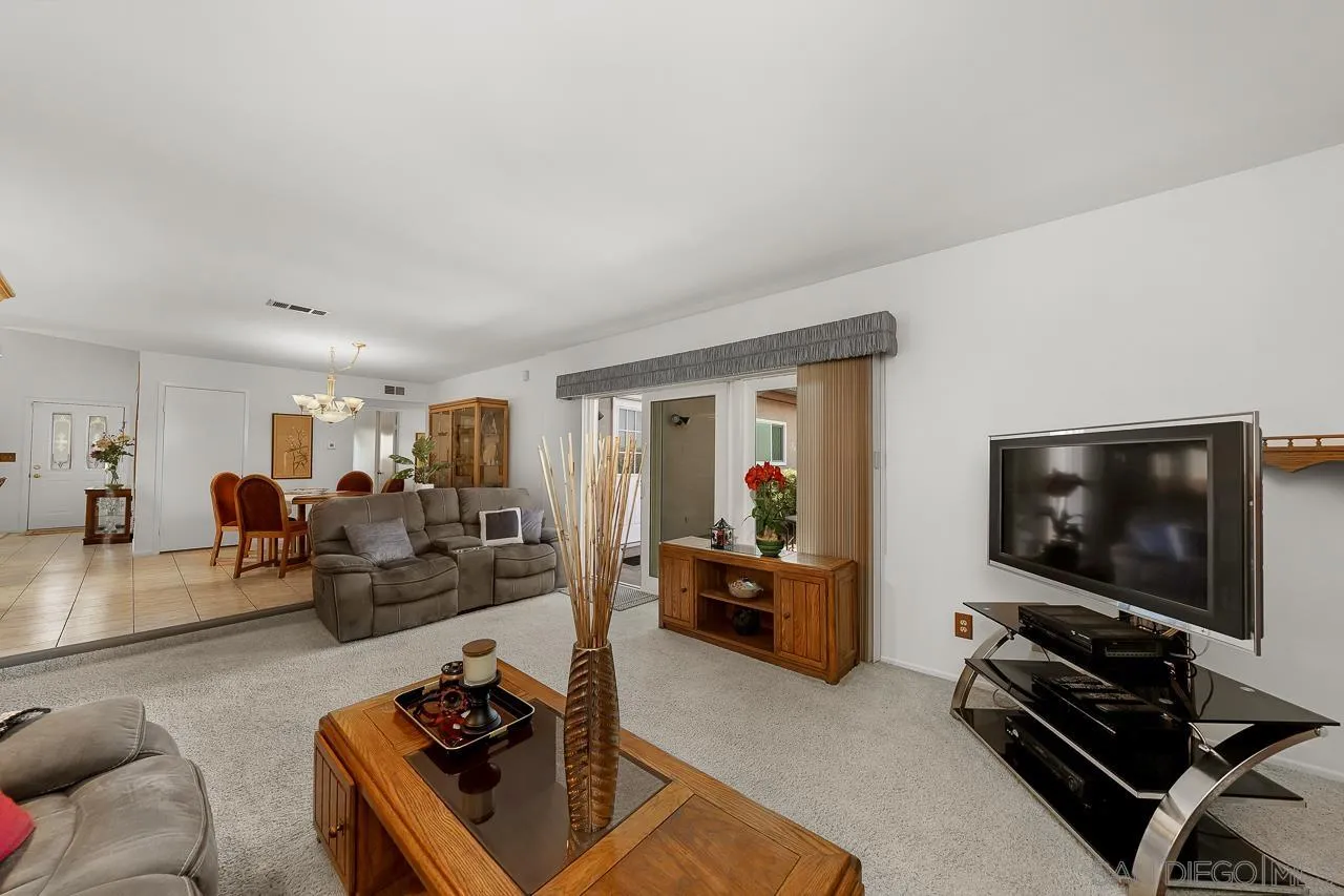 2711 South Barcelona Street Spring Valley, CA 91977 - Photo 11 of 38 a living room with furniture and a flat screen tv
