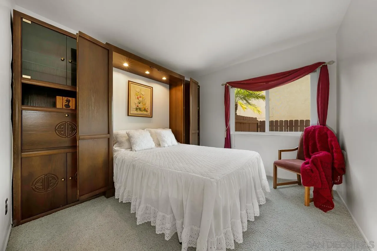 2711 South Barcelona Street Spring Valley, CA 91977 - Photo 12 of 38 a bedroom with a bed and a window