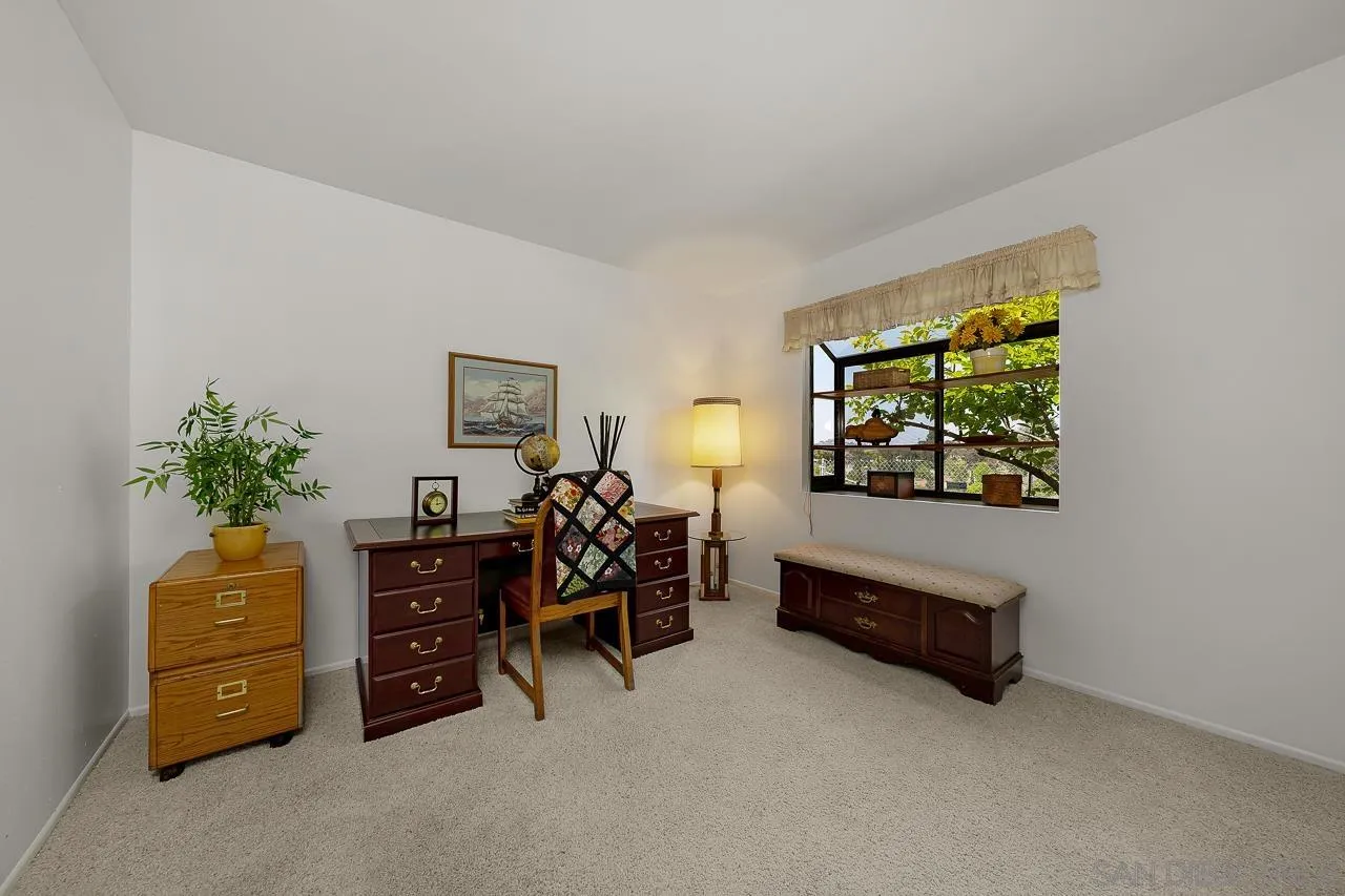 2711 South Barcelona Street Spring Valley, CA 91977 - Photo 17 of 38 a bedroom with furniture and a bed