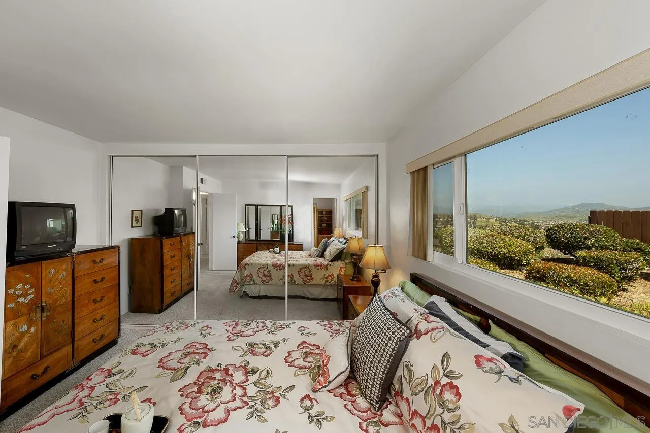 2711 South Barcelona Street Spring Valley, CA 91977 - Photo 20 of 38 a living room with furniture and a flat screen tv
