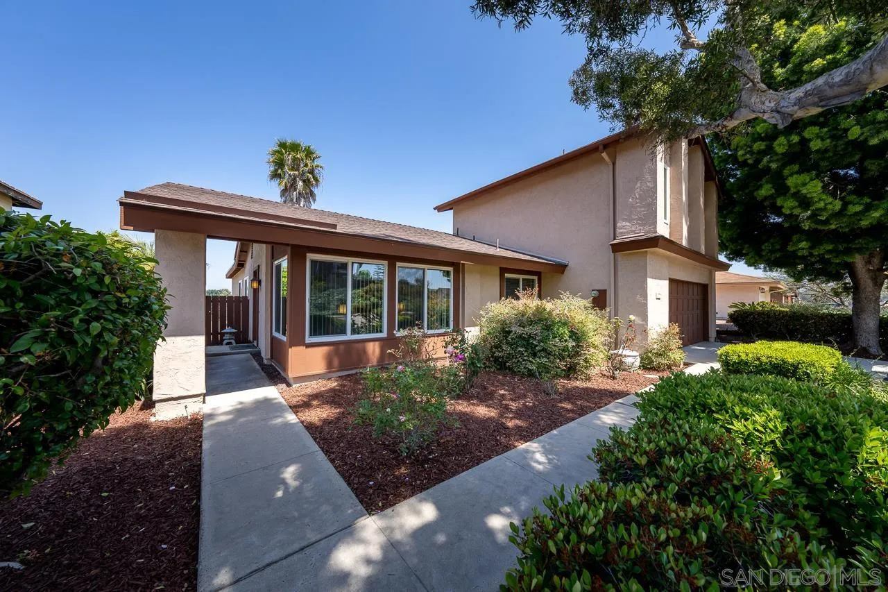 2711 South Barcelona Street Spring Valley, CA 91977 - Photo 2 of 38 a front view of a house with a yard