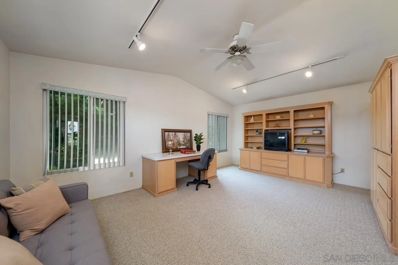 2711 South Barcelona Street Spring Valley, CA 91977 - Photo 23 of 38 a living room with furniture and a flat screen tv