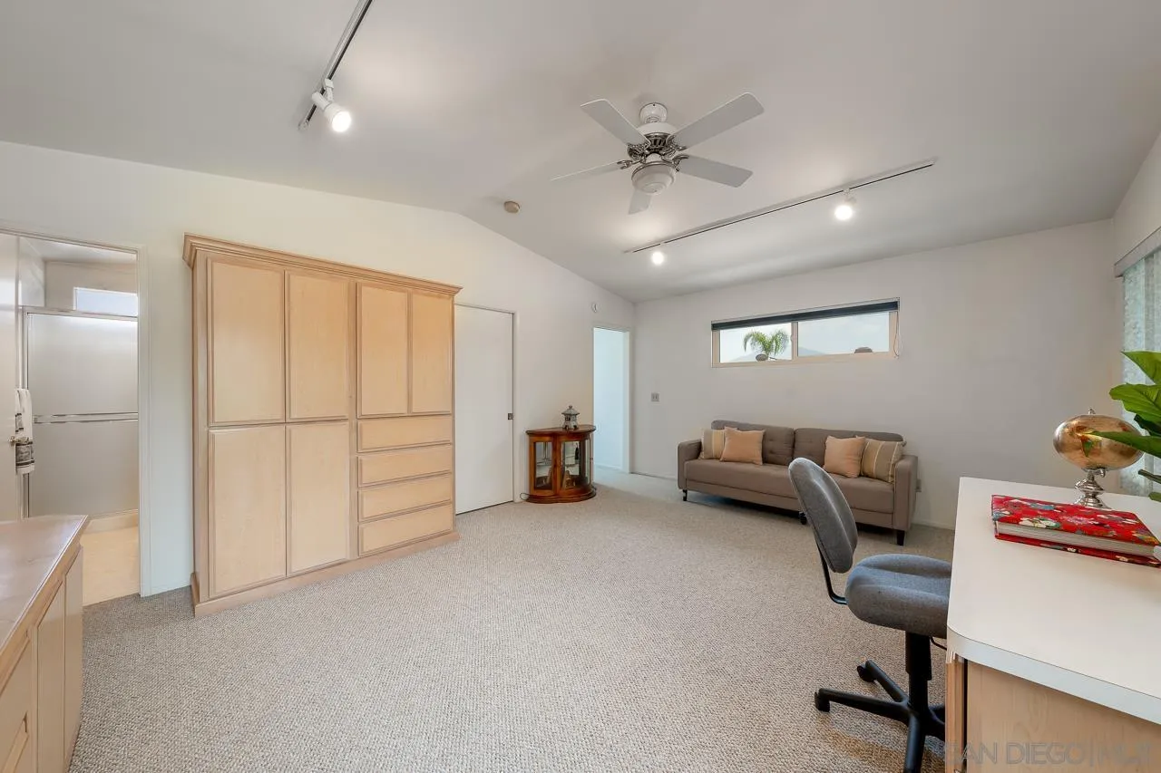 2711 South Barcelona Street Spring Valley, CA 91977 - Photo 24 of 38 a livingroom with furniture and a ceiling fan