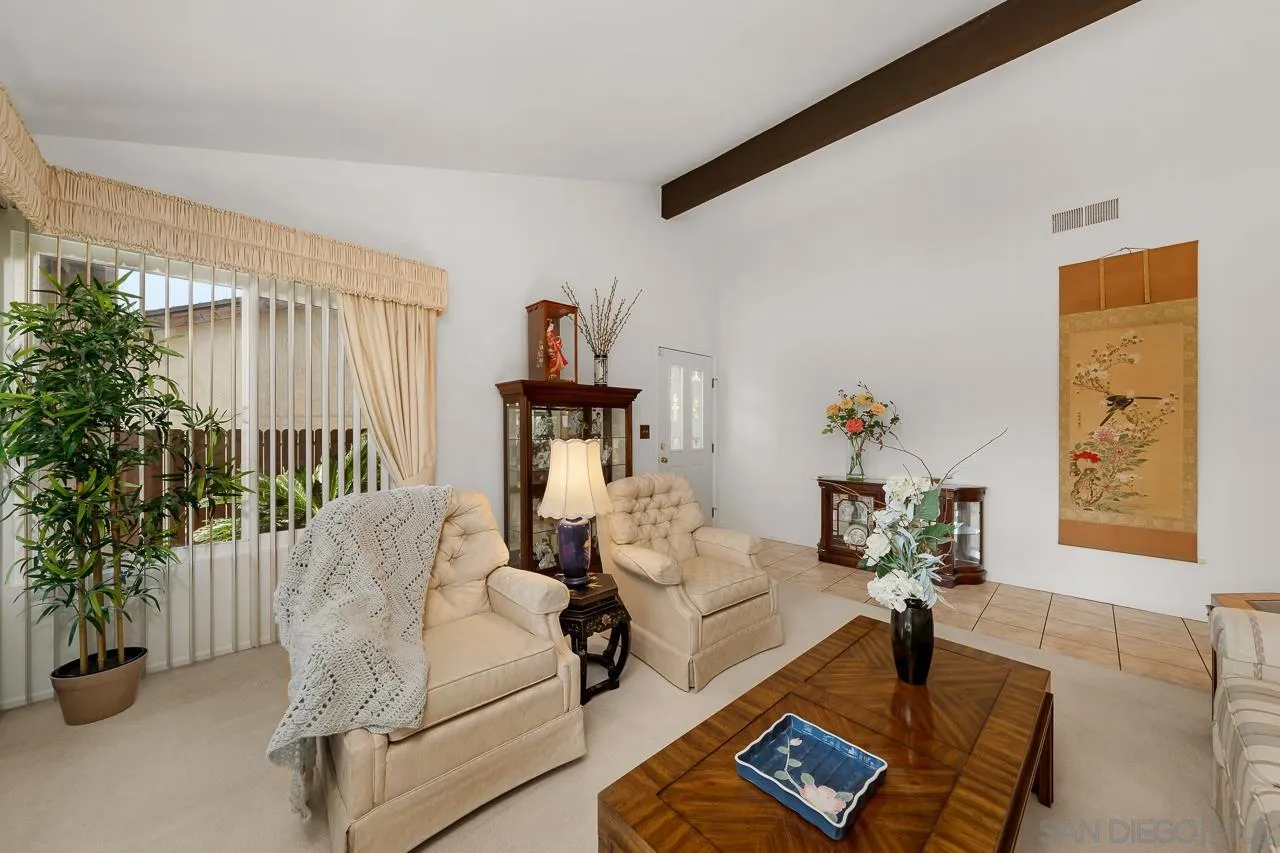 2711 South Barcelona Street Spring Valley, CA 91977 - Photo 4 of 38 a living room with furniture and a potted plant