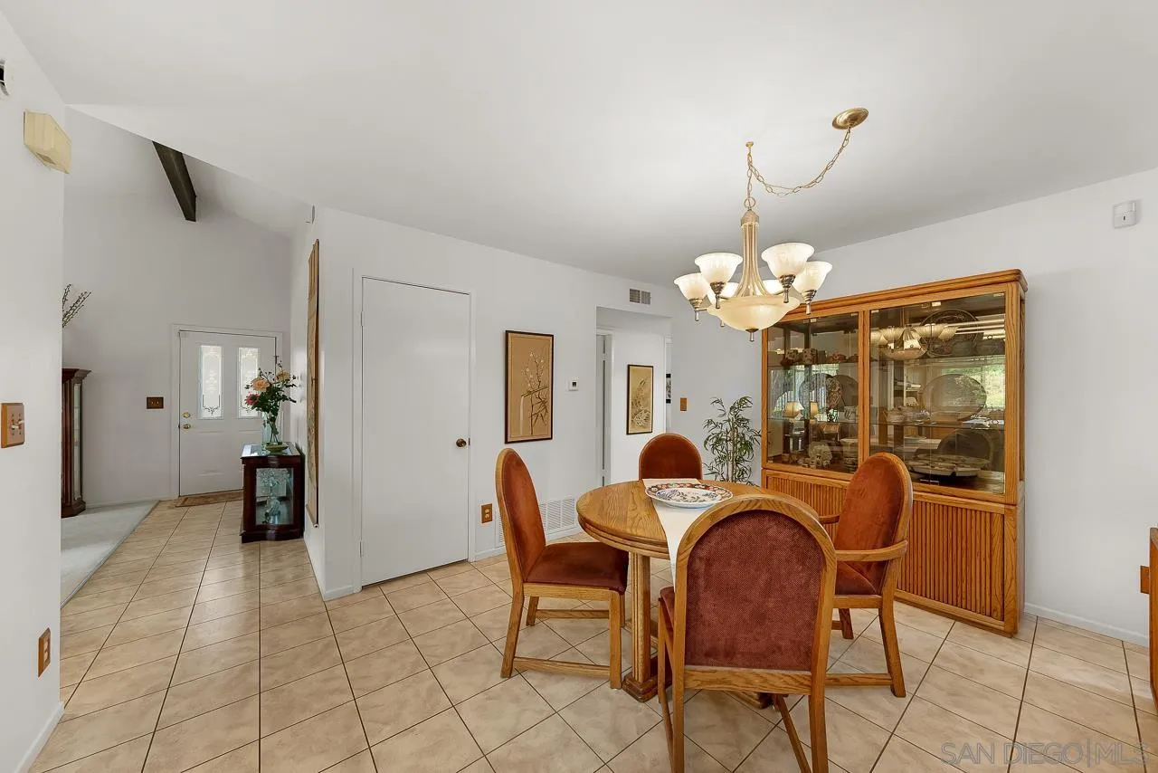 2711 South Barcelona Street Spring Valley, CA 91977 - Photo 5 of 38 a dining room with furniture and chandelier kitchen view