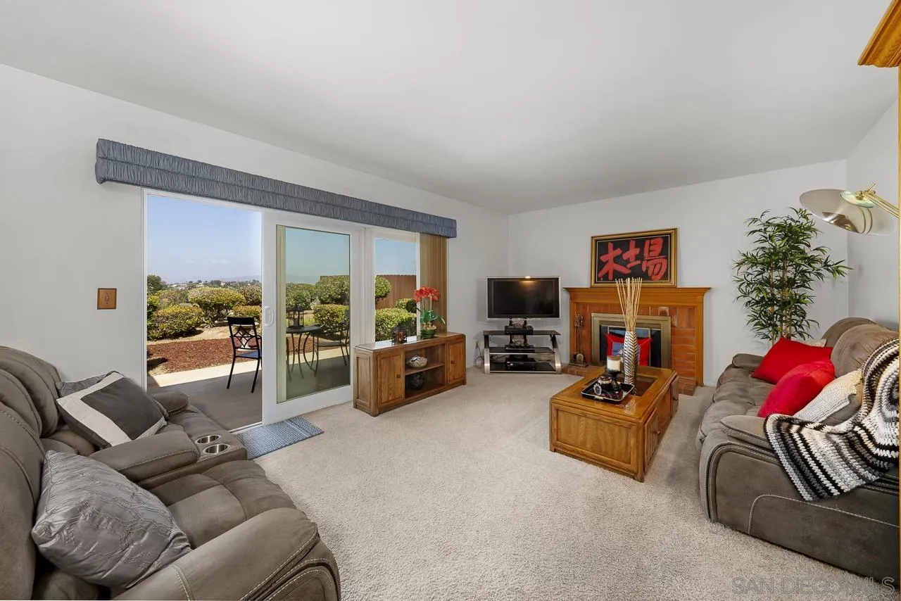 2711 South Barcelona Street Spring Valley, CA 91977 - Photo 10 of 38 a living room with furniture and a flat screen tv