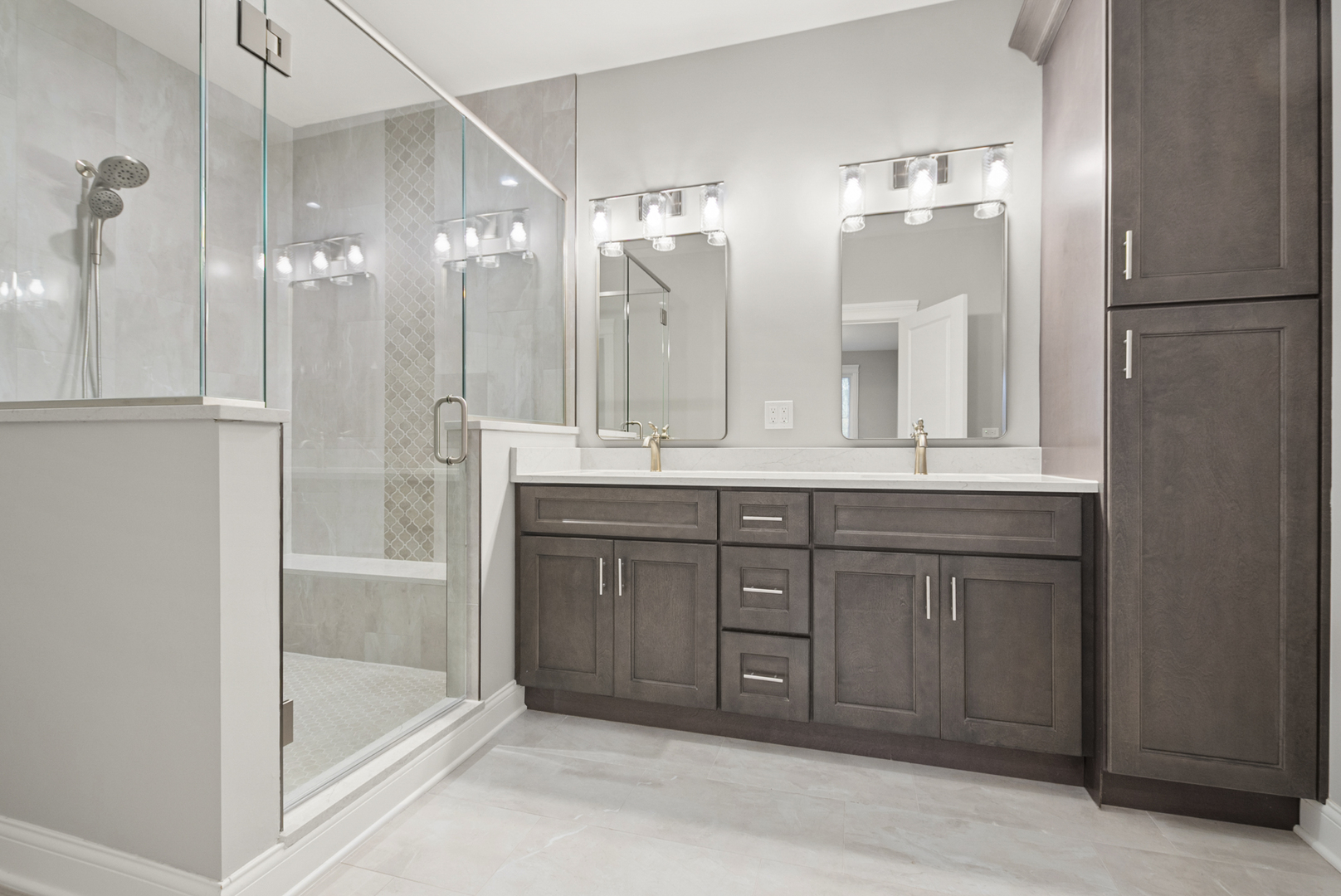 11323 1st Street Mokena, IL 60448 - Photo 14 of 26 a bathroom with a bathtub a double vanity sink and mirror