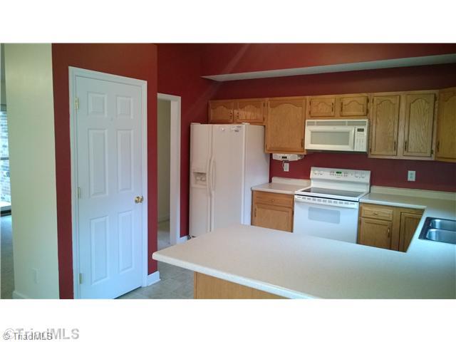 130 Baxter Road Winston-Salem, NC 27107 - Photo 16 of 16 Kitchen. The pantry is centrally located in this open floor plan.