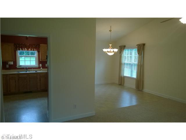 130 Baxter Road Winston-Salem, NC 27107 - Photo 6 of 16 Living Room. View into the dining room and kitchen.
