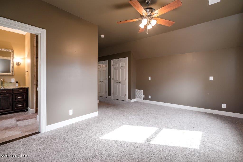 The master bedroom has ample closet space and an en suite bath