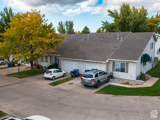 190 West 700 North Logan, UT 84321 - Photo 5 of 51 View of front of house with driveway, roof with shingles, and a front lawn