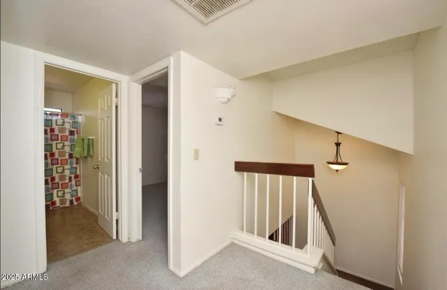 a view of a hallway with entryway door