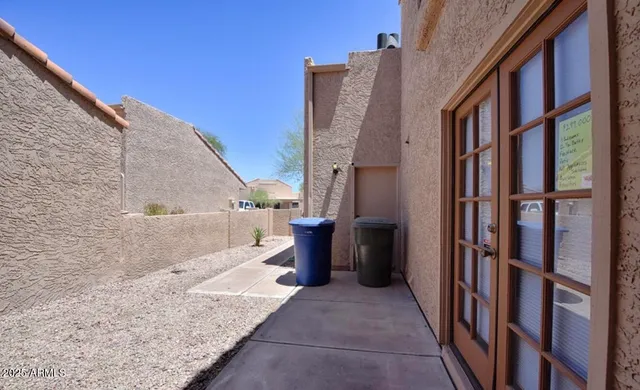 a view of an buildings with entryway and a yard