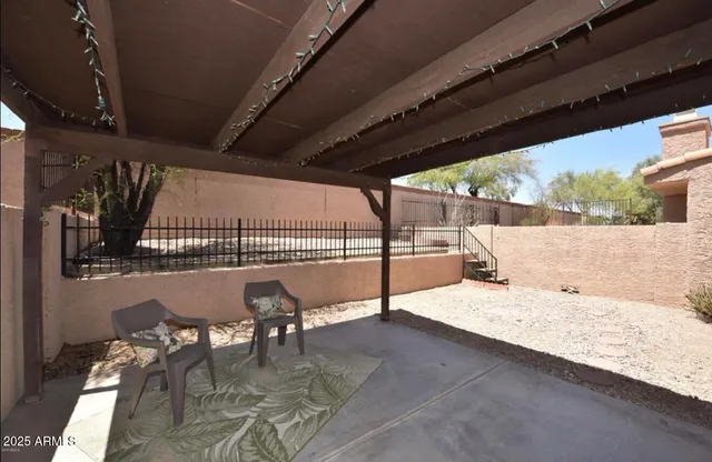 a view of a swimming pool with a patio