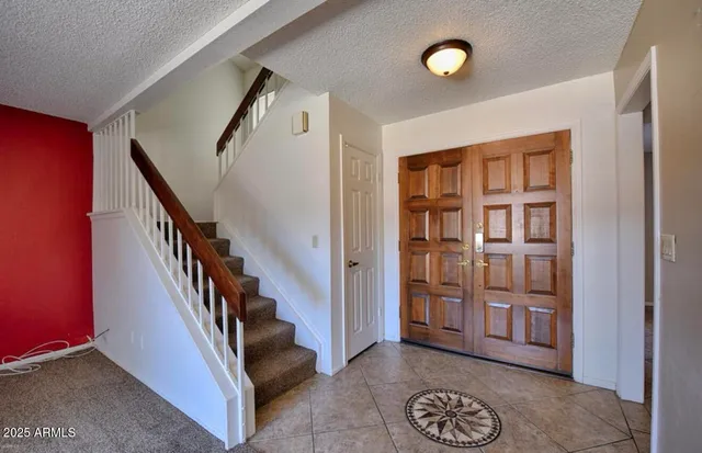 a view of entryway with stairs and furniture
