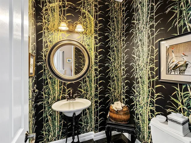 a dining room with furniture a chandelier and window