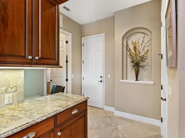 a bath tub sitting in a bathroom next to a window