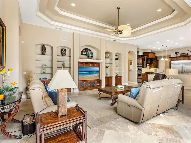 a living room with furniture a window and a table