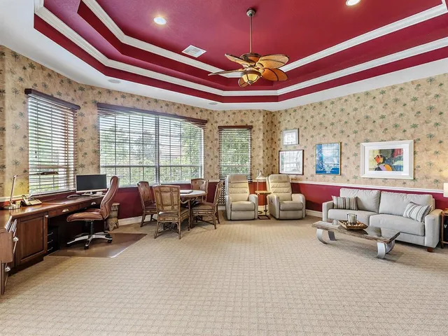 a dining room with furniture a window and a chandelier