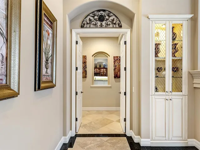a view of a swimming pool with chairs in patio