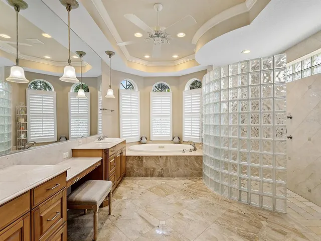 an aerial view of a house with a swimming pool yard and outdoor seating