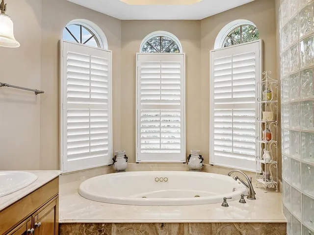 an aerial view of residential houses with outdoor space and river