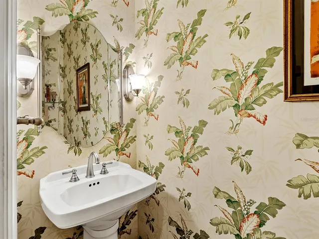 a view of a street with cars parked in front of it