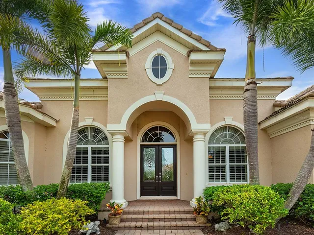 a view of a living room and entry way to room