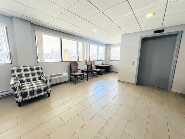a living room with furniture and a window