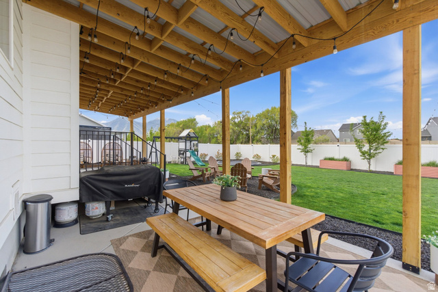 596 South Meade Street Mapleton, UT 84664 - Photo 28 of 38 Fenced backyard with outdoor dining area, a patio, area for grilling, and a playground