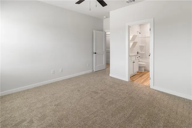 a bathroom with a granite countertop sink mirror vanity and bathtub