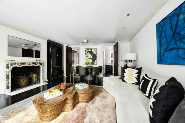 a living room with fireplace furniture and a flat screen tv