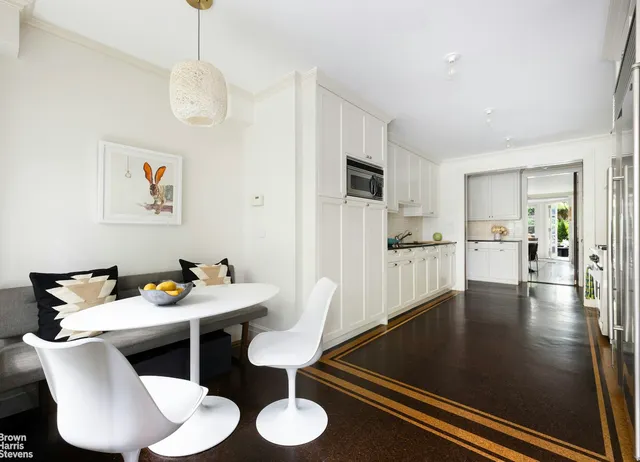 a kitchen with stainless steel appliances a stove sink microwave and cabinets