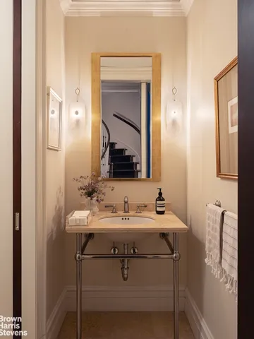 a bedroom with furniture and a book shelf