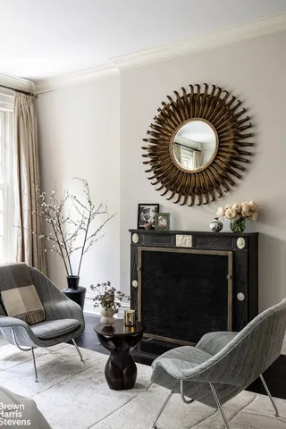 a living room with furniture and large windows