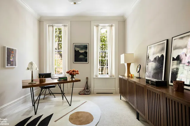 a en suite bathroom with a double vanity sink a mirror and a shower