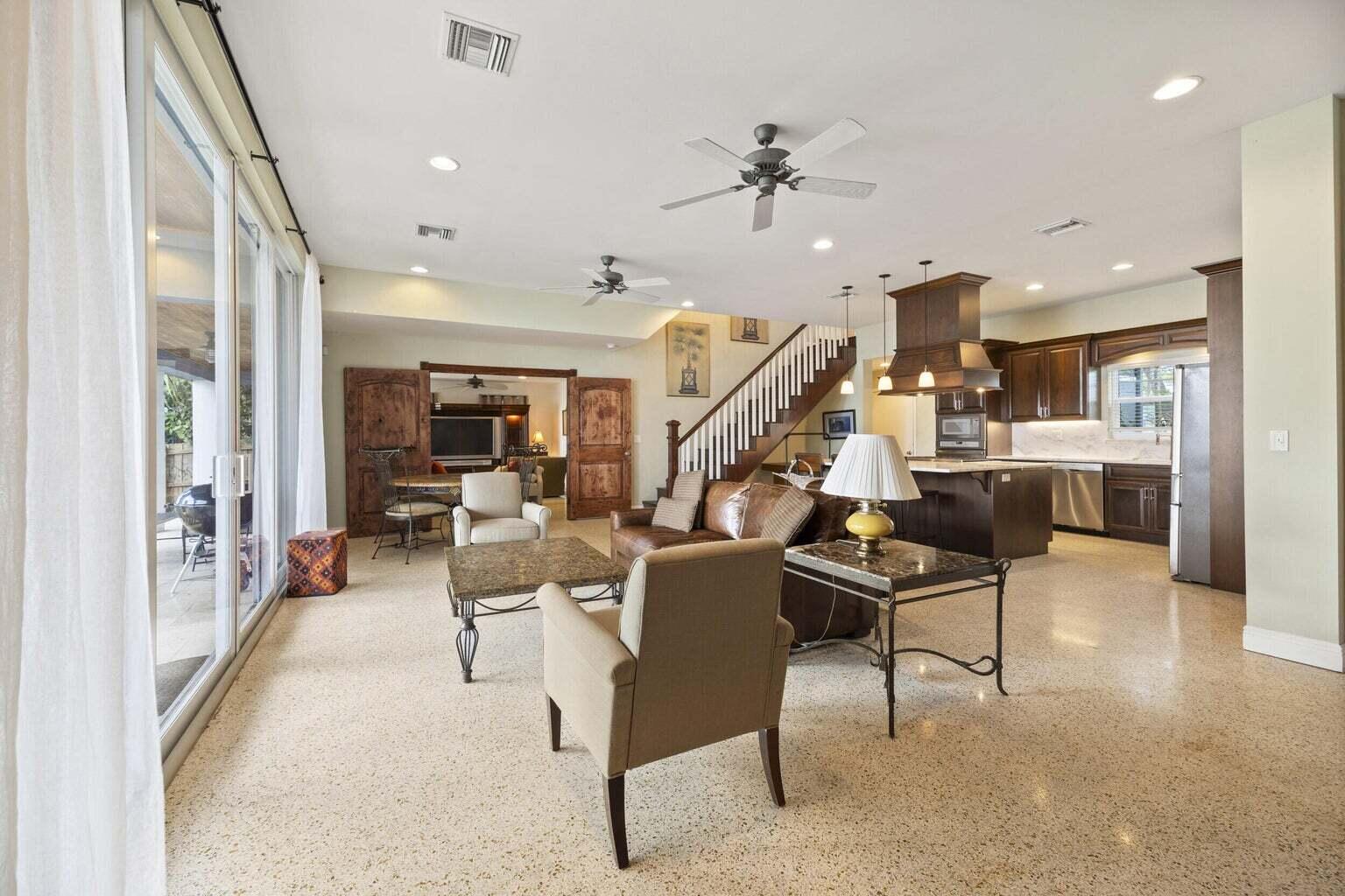 1009 Northwest Terrace Road Stuart, FL 34994 - Photo 12 of 69 a living room with lots of furniture and a view of kitchen