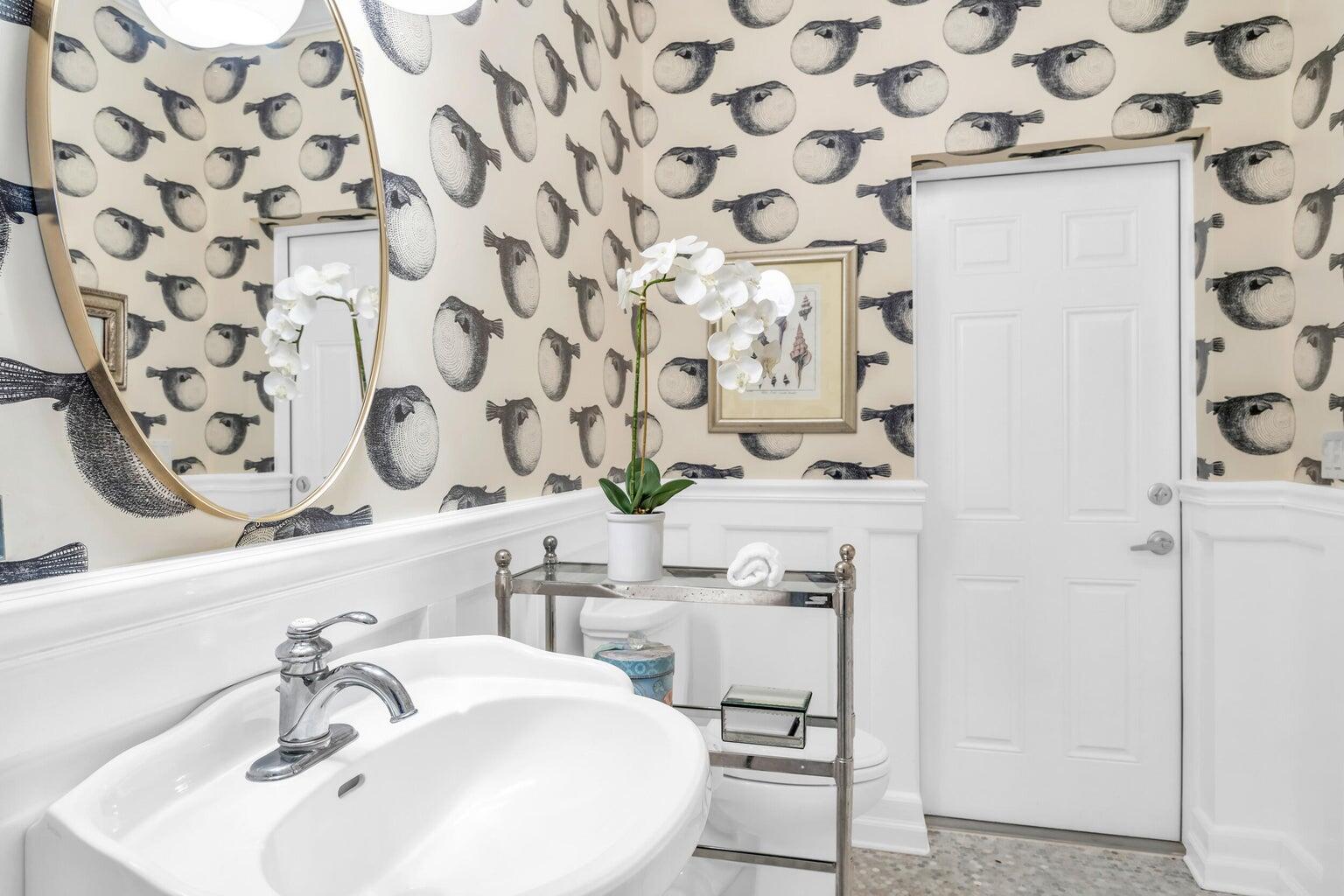 1009 Northwest Terrace Road Stuart, FL 34994 - Photo 19 of 69 a bathroom with a sink and a mirror