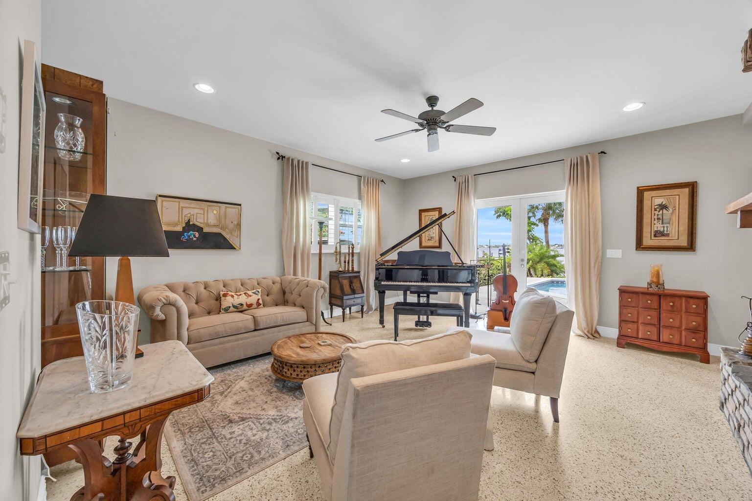 1009 Northwest Terrace Road Stuart, FL 34994 - Photo 20 of 69 a living room with furniture a lamp and a flat screen tv