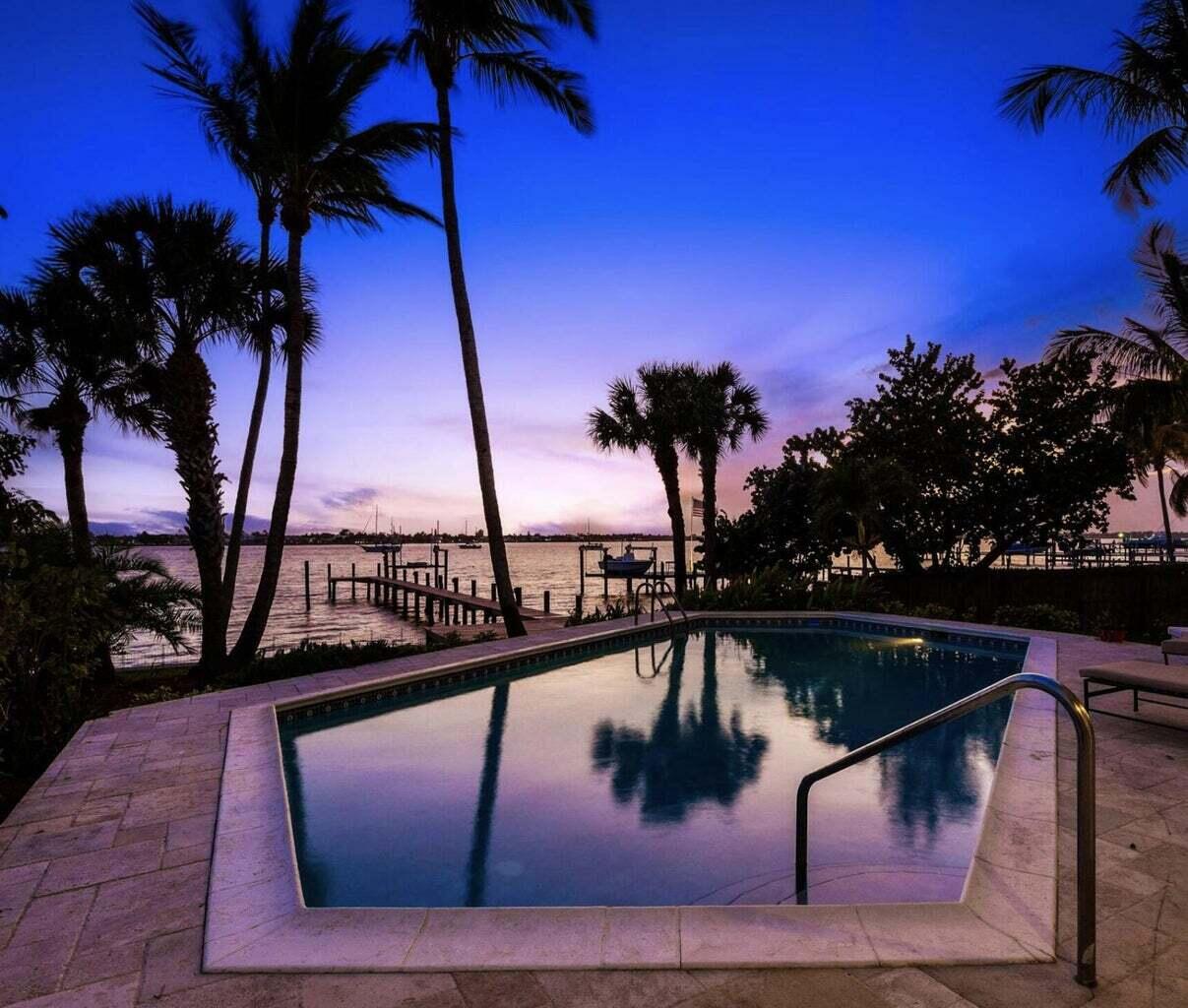 1009 Northwest Terrace Road Stuart, FL 34994 - Photo 23 of 69 a view of swimming pool with outdoor seating and yard in the back