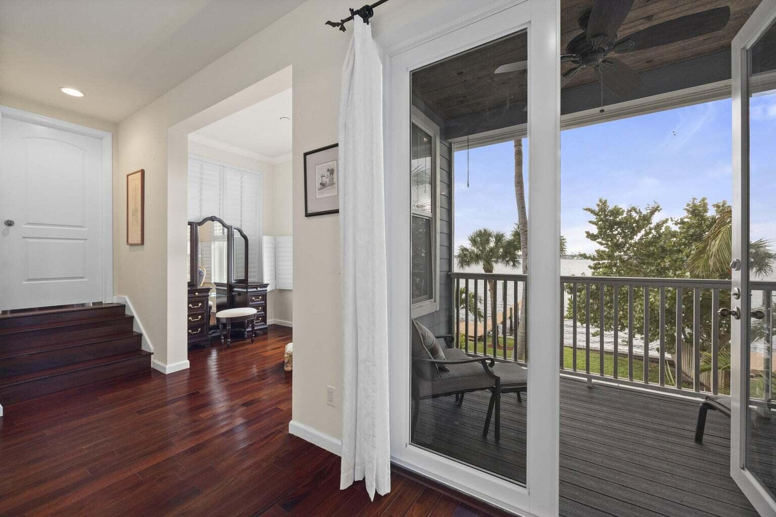 1009 Northwest Terrace Road Stuart, FL 34994 - Photo 28 of 69 a view of a hallway with wooden floor and door