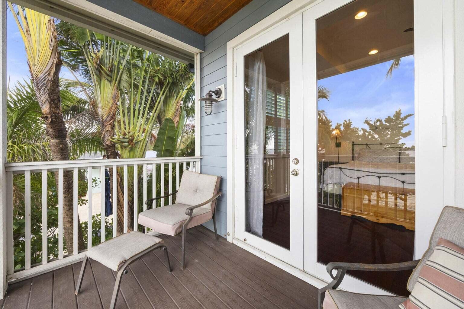 1009 Northwest Terrace Road Stuart, FL 34994 - Photo 29 of 69 a view of a chair and table in the balcony